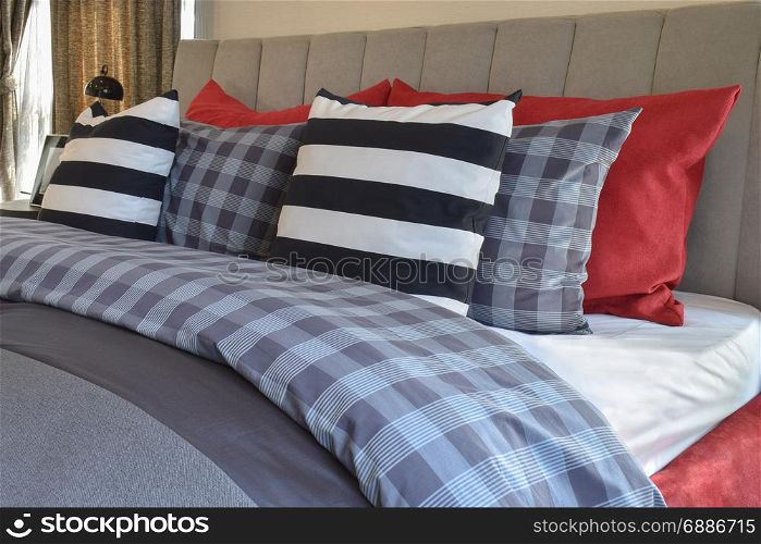modern bedroom interior with striped pillow on bed