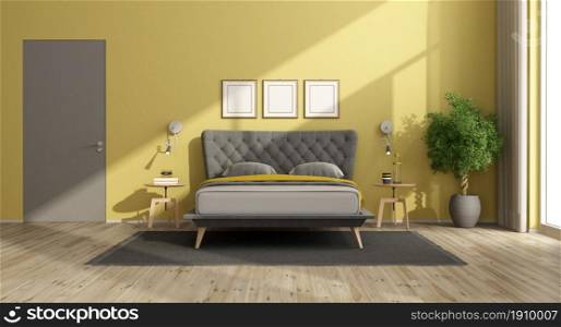 Modern bedroom with yellow walls black and gray double bed and closed door - 3d rendering. Modern bedroom with yellow walls and gray bed