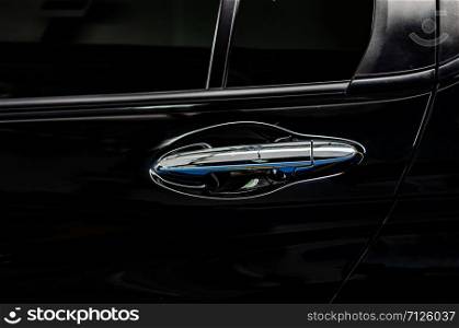 Modern black car door handle.Car door handle is an external part of the car.