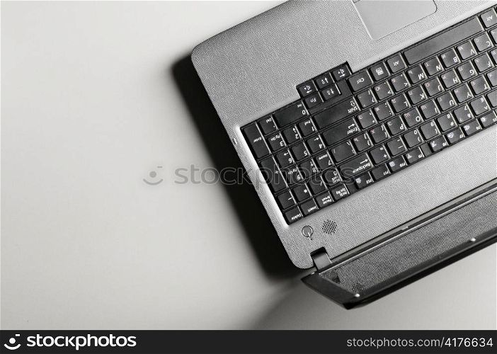 modern black laptop on grey table, view from above