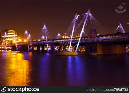 Modern bridge in London UK at night