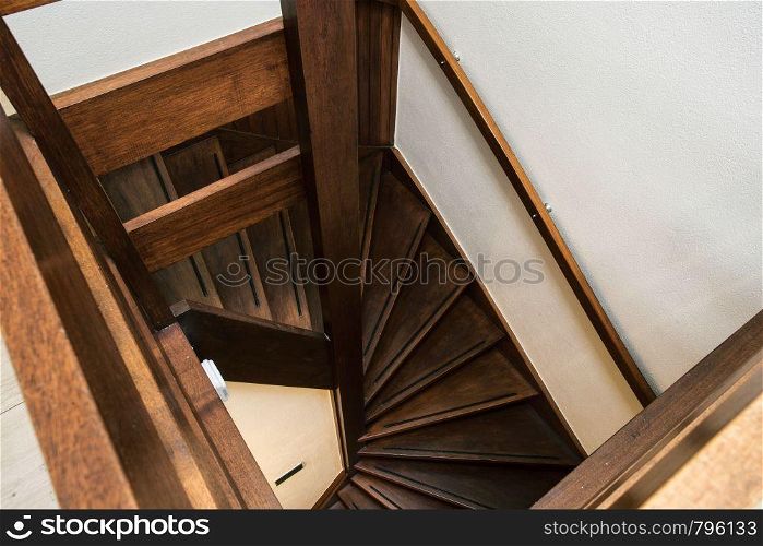 Modern brown oak wooden stairs in new renovated house interior, modern dark brown design. Modern brown oak wooden stairs in new renovated house interior