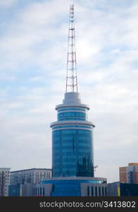 Modern building and communicate mast. Astana, capital of Kazakhstan, march 2007