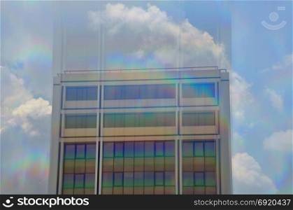 Modern building exterior motion blur through prism. Abstract architecture.