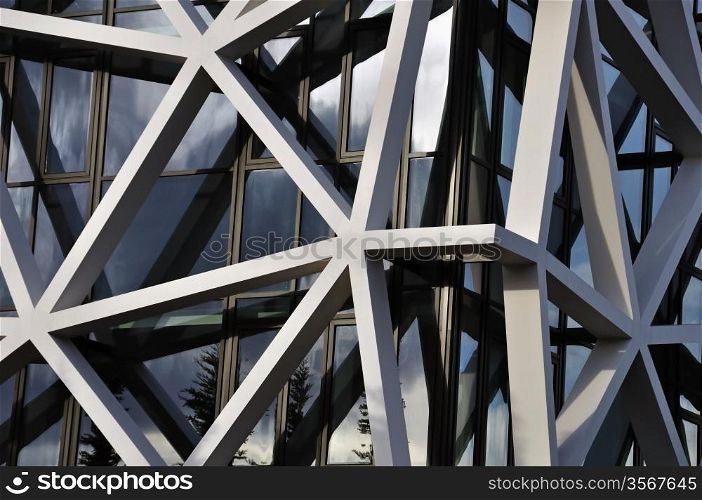 Modern building facade with asymmetric pattern. Abstract architectural background.