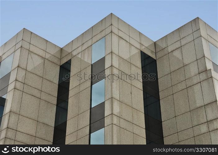 Modern building marble and glass facade corners abstract architecture background.