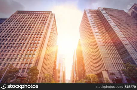 Modern building on sunset with road in Tokyo, Japan.