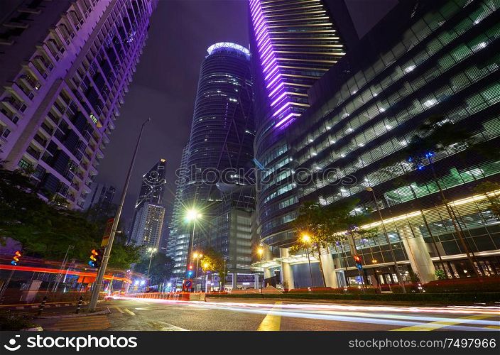 Modern building with light trails on night scene background