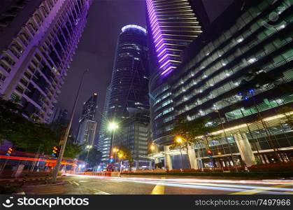 Modern building with light trails on night scene background