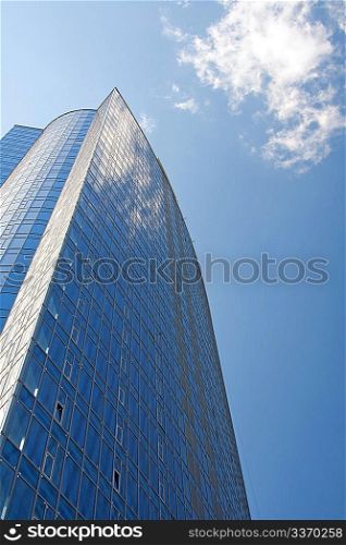 Modern building with sky and cloud reflection