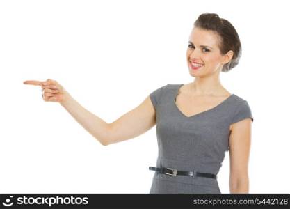 Modern business woman pointing in corner