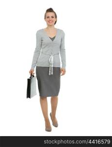 Modern business woman with briefcase making step forward