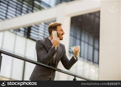 Modern businessman talking over the phone in the office