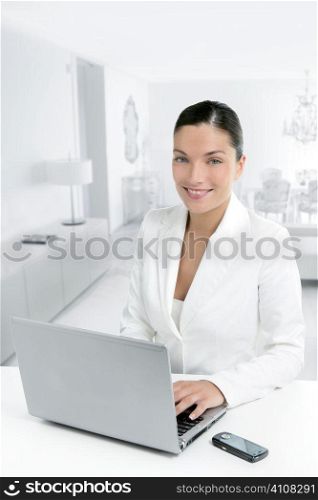 Modern businesswoman working at home with laptop computer