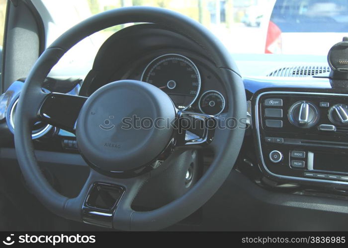 Modern car interior in different shades of grey