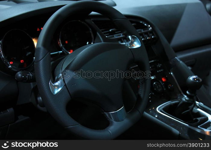 Modern car interior, luxurious materials in different shades of grey