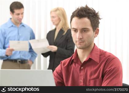 Modern Caucasian Male Business Professional Working Alone At A Laptop Computer