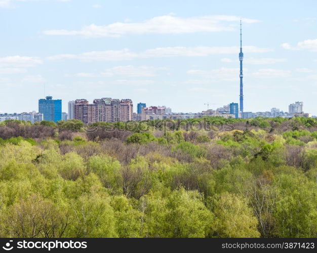 modern city and green woods in spring day