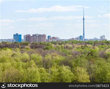 modern city and green woods in spring day