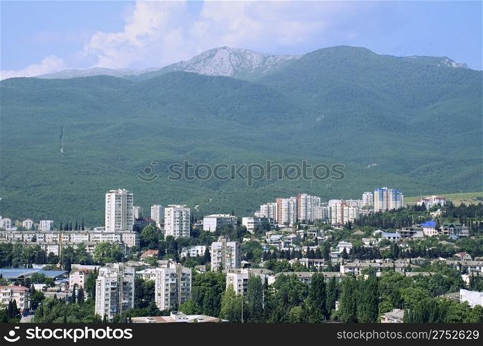 Modern city located in an environment of mountains. (Alushta - the Crimean mountains)