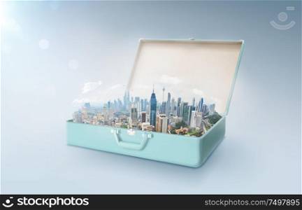 Modern city skyline in an open retro vintage suitcase isolated on light blue background .