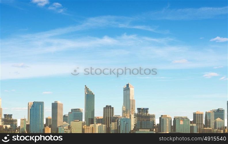 Modern city. Urban scene with buildings and skyscrapers in sunlight