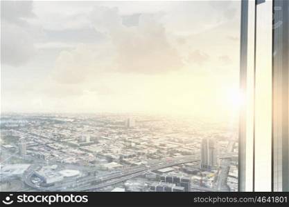 Modern city view. Top view of modern city in lights of sunset