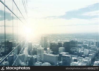 Modern city view. Top view of modern city in lights of sunset