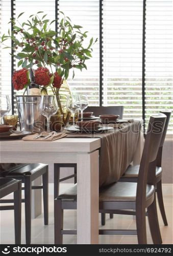 Modern classic dining set on wooden table with natural lighting