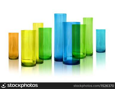 Modern color glass vases row on white reflective background. Modern glass vases