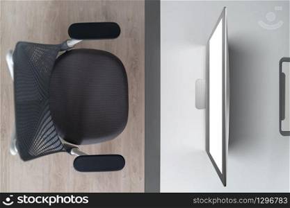 Modern comfortable workspace - computer desk with mockup white computer monitor and orthopaedic chair. Top view. Home working outside office concept.. Top view modern mock up computer screen on an office table.