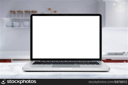 Modern computer,laptop with blank screen on Wood table top on blurred kitchen background