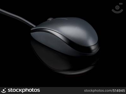 Modern computer mouse on a black background