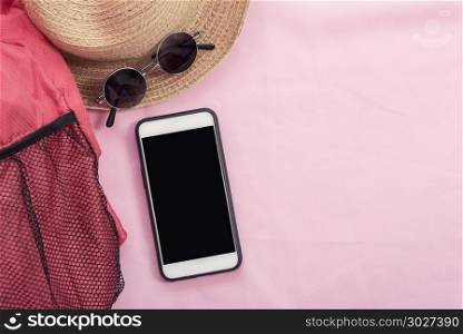 Modern connection technology background, mobile, red bag, hat an. Modern connection technology background, mobile, red bag, hat and sunglasses on pink background. Lifestyle travel background.