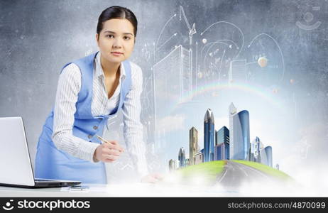 Modern construction development design. Young smiling businesswoman working with modern real estate concept