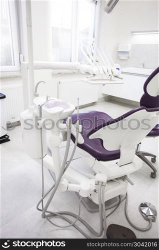 Modern dental practice. . Modern dental practice. Dental chair and other accessories used by dentists.
