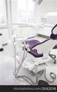 Modern dental practice. . Modern dental practice. Dental chair and other accessories used by dentists.