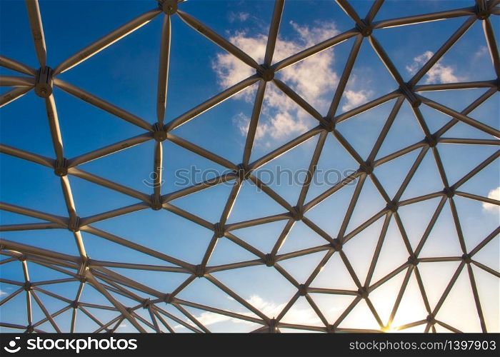 Modern design curved steel frame structure under a blue sky