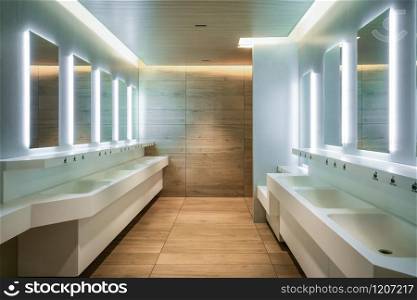 Modern design of public toilet and restroom. Luxury interior.. Modern design of public toilet and restroom.