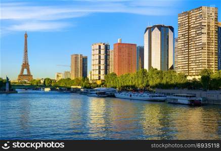 Modern district of skyscrapers on Seine with view on Eiffel Tower in Paris, France
