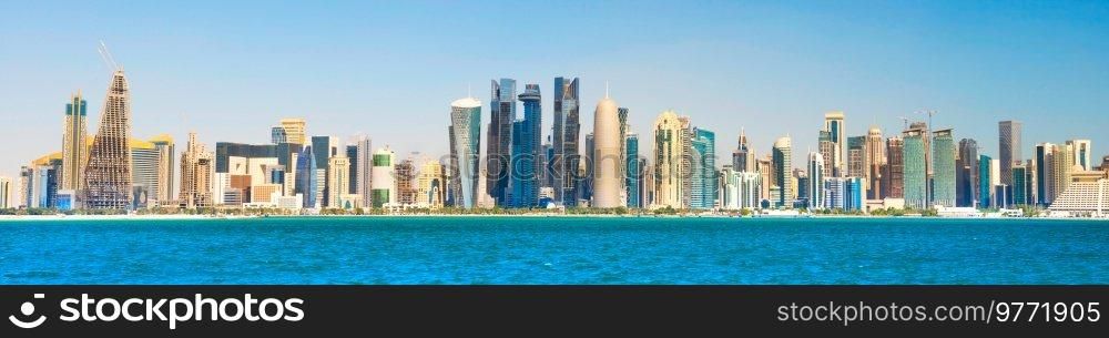 Modern downtown with skyscrapers, view from sea bay. Doha, Qatar