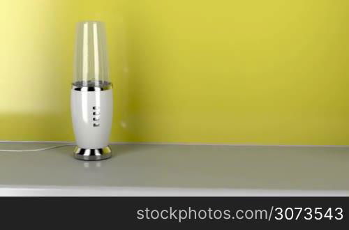 Modern electric blender in the kitchen, zoom to the blades