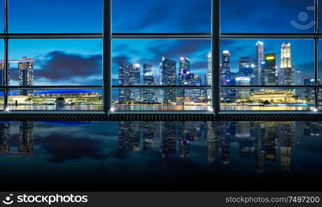 Modern empty and clean office interior with glass windows , Singapore city skyline background , early morning scene .