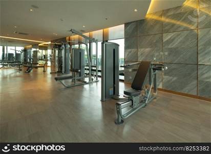 Modern fitness center with gym equipment decoration. interior design background