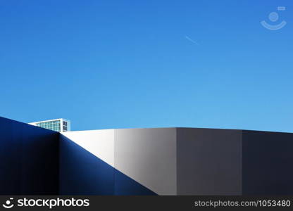 Modern fragment on a construction building, against blue sky, Sunny day. Modern fragment on a construction building, against blue sky