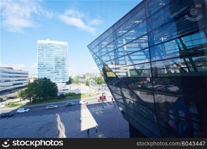 modern glass building window facade with cityscape in baclground