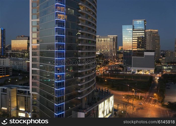 Modern glass buildings at night, Dallas, Texas, USA