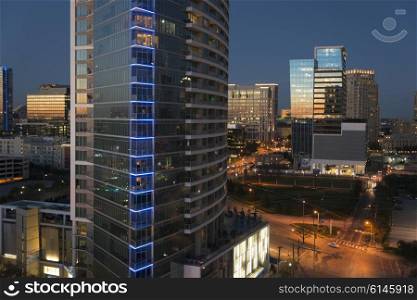 Modern glass buildings at night, Dallas, Texas, USA