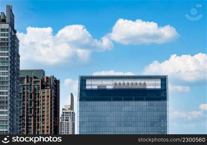 Modern glass office building and apartment building. Exterior office glass building architecture. Company glass window. Skyscraper corporate building. Financial business center tower. Real estate.