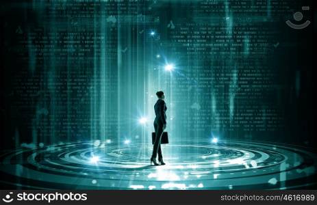 Modern global technologies. Back view of businesswoman with suitcase in hands looking at virtual panel